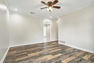 Unfurnished room featuring dark wood-type flooring