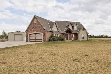 View of front of property featuring fence, concret