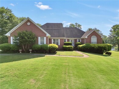 Single story home with brick siding and a front la