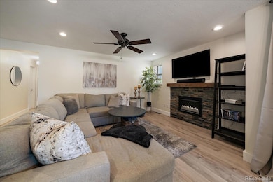 Perfect gathering area featuring a cozy fireplace and modern updates.