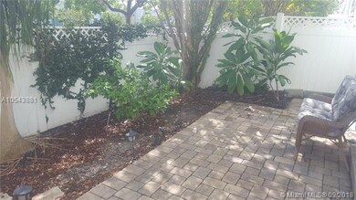 The sun falls softly on the courtyard patio.