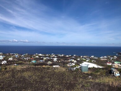 Lot extends down hill below large building pad.  Driveway is to right.