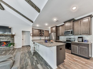 Kitchen featuring stainless steel appliances, open