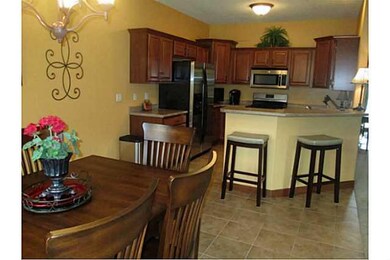 Exterior Front. Dining area next to doorway to dec