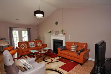 Living room with vaulted ceiling and gas log fireplace!