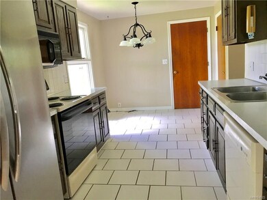 Dine-in kitchen with ceramic flooring.