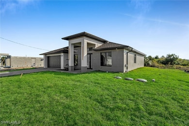 View of front of property with a garage and a fron