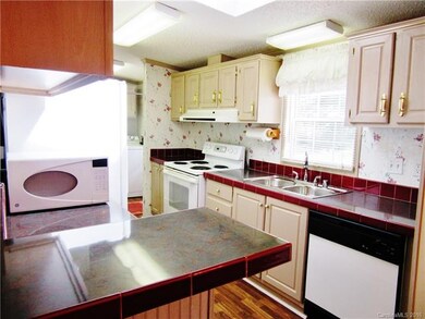 KITCHEN W/ SKYLIGHT, LAMINATE & APPLIANCES