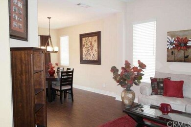 Living room  leads to formal dining room.