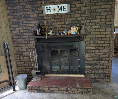 Detailed view of a fireplace and brick wall