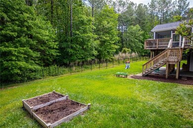Back yard with raised garden planters.