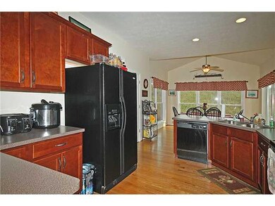 Kitchen Kitchen with hardwood floors, breakfast ba