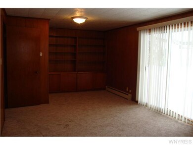 Family Room. Built-in book cases. Sliding door to 