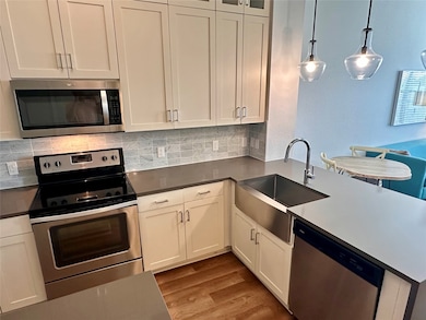 view in kitchen behind island
