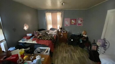 Bedroom with wood finished floors