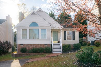View of front facade with a front yard and central