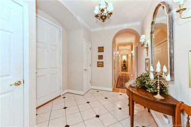 Foyer, 2 coat closets and arched doorways in Hallw