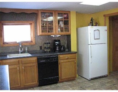 Kitchen. Includes flat top stove,...
