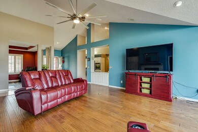 Large living space with open view into kitchen and