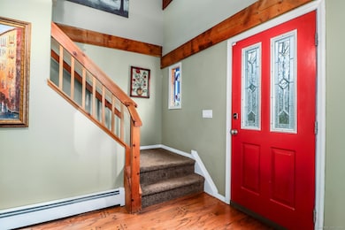 Welcoming foyer & stained glass window