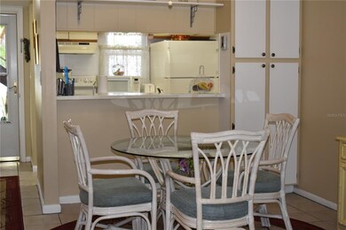 Entry into condo with kitchen and dining area