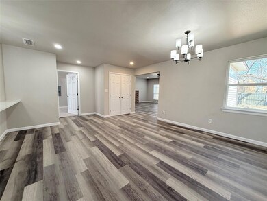Unfurnished room featuring a notable chandelier, r