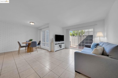Living room with brick wall and light tile patterned floors