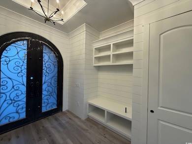 Foyer entrance with hardwood / wood-style floors, 