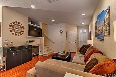 View of entry and living room with fireplace, rece