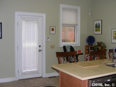 Kitchen. Kitchen door to enclosed backyard.
