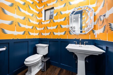 Custom wallpaper in powder room.