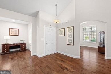 Entry/Foyer area. Gorgeous hardwoods. Plantations shutters throughout the home. The ?nook? is to the left and the ?sunroom? is to the right.