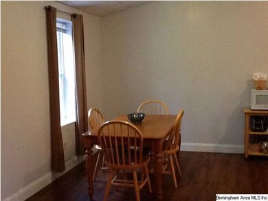 Nice eating area that is open to the kitchen and g