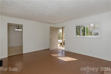 View from back corner of living room into the kitc