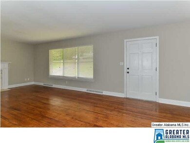 Large windows fill the living and dining rooms wit