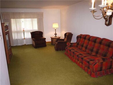 Living Room. Under the carpet Hardwood through the