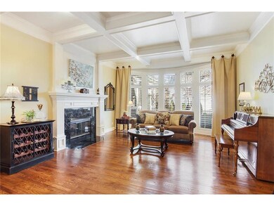 Nice size living room with wood beamed ceiling and