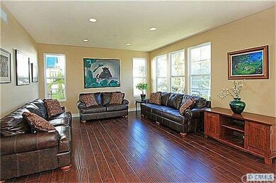 The large formal living room and formal dining com