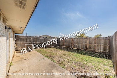 Fenced backyard featuring a patio area