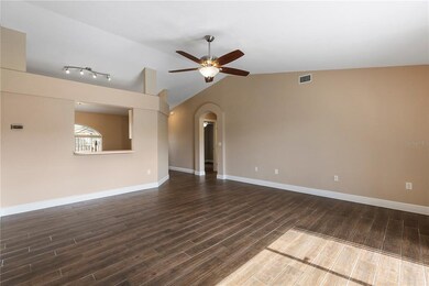 Great Room with arched walkway leading to 2 additi