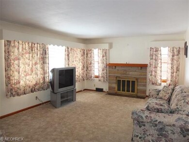 Spacious living room with fireplace and picture wi