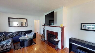 SPACIOUS LIVING ROOM W/FIREPLACE & HARDWOOD FLOORS