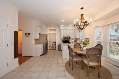 Wide view of kitchen/breakfast area.