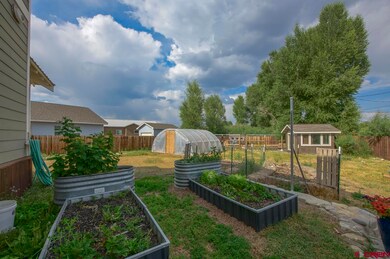 8 raised bed gardens, fenced, chicken coop, shed, 