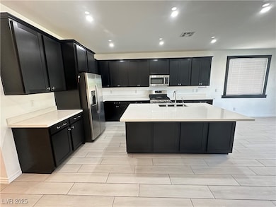Kitchen featuring appliances with stainless steel