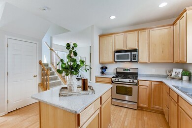 Kitchen with granite counters, hardwood floors