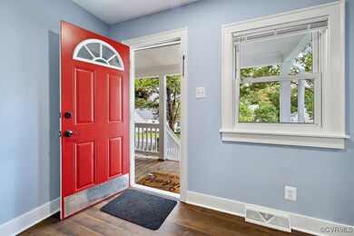 Entryway with dark hardwood / wood-style flooring