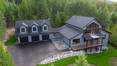 View of subject property with a heavily wooded area