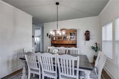Dining area featuring a chandelier, wood finished 