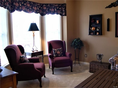 Triple windows in the formal living room brings in